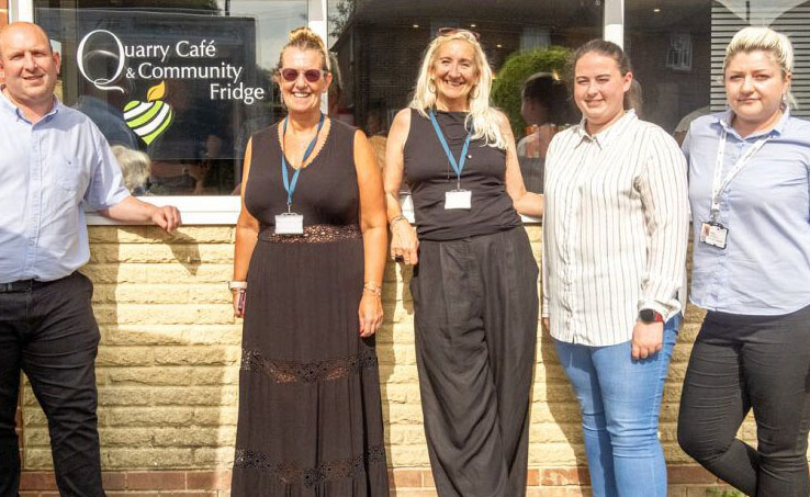 group standing outside community cafe