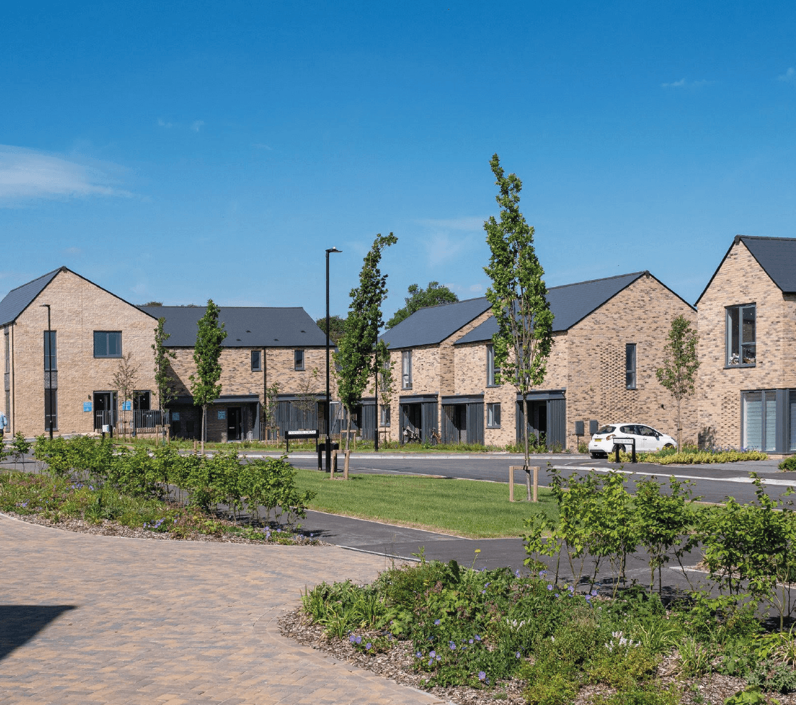 series of new build properties with garden in the centre