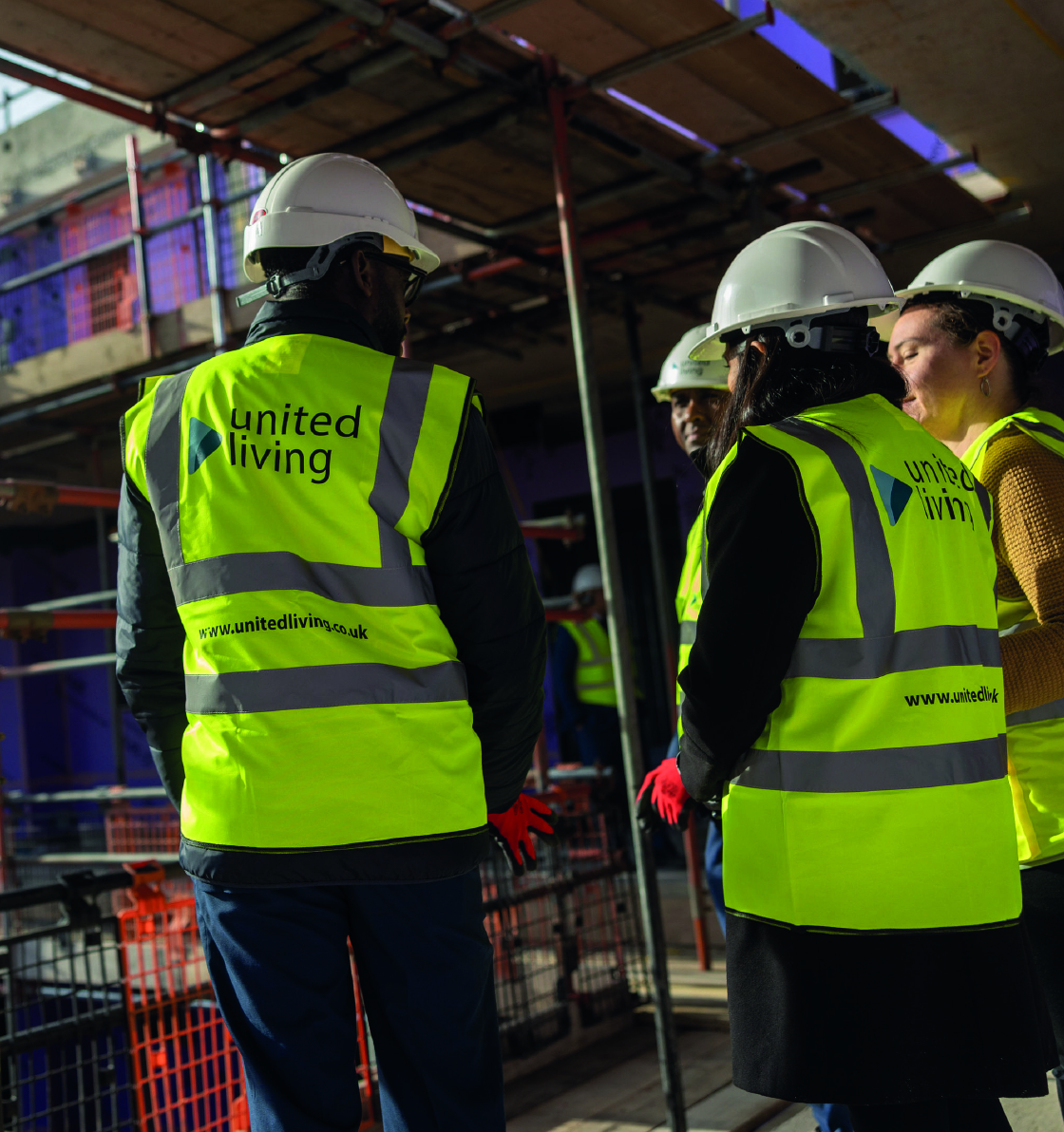 united living employees stood on scaffolding