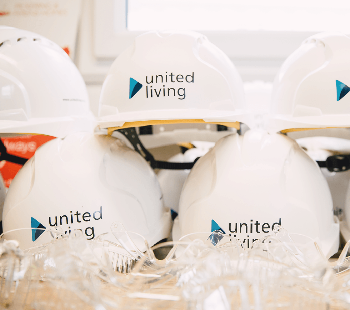 United Living branded hard hats