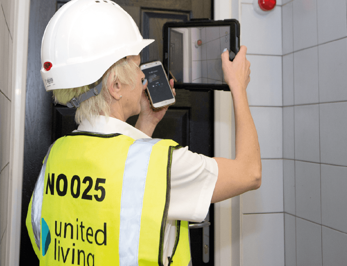 employee checking residential home for damp and mould