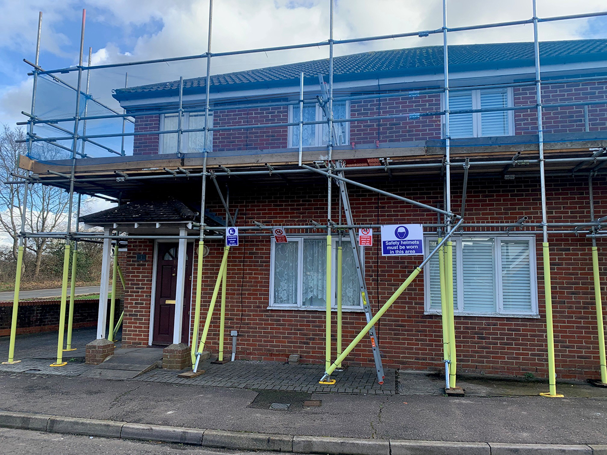 residential home with scaffolding