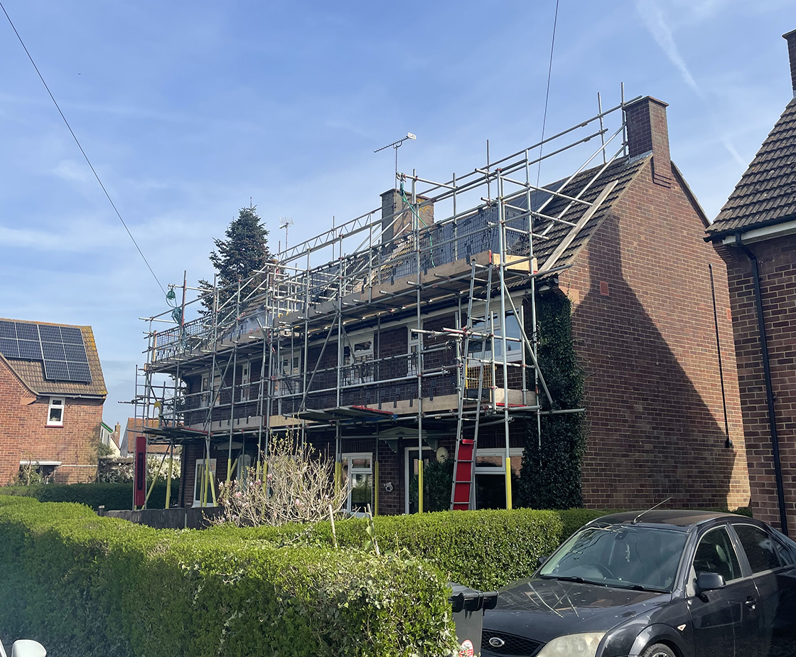residential home with scaffolding