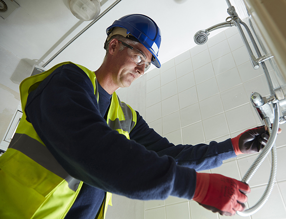 man installing shower