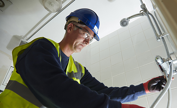 man installing shower