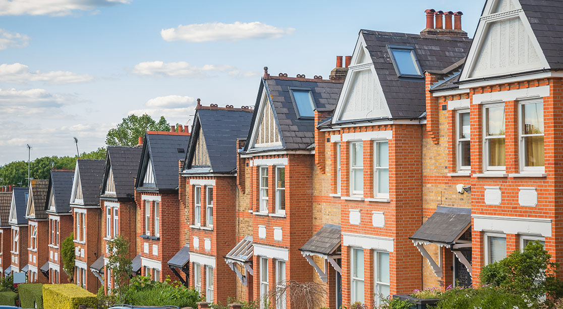 Row of identical English terraced houses in Crouch End, North London