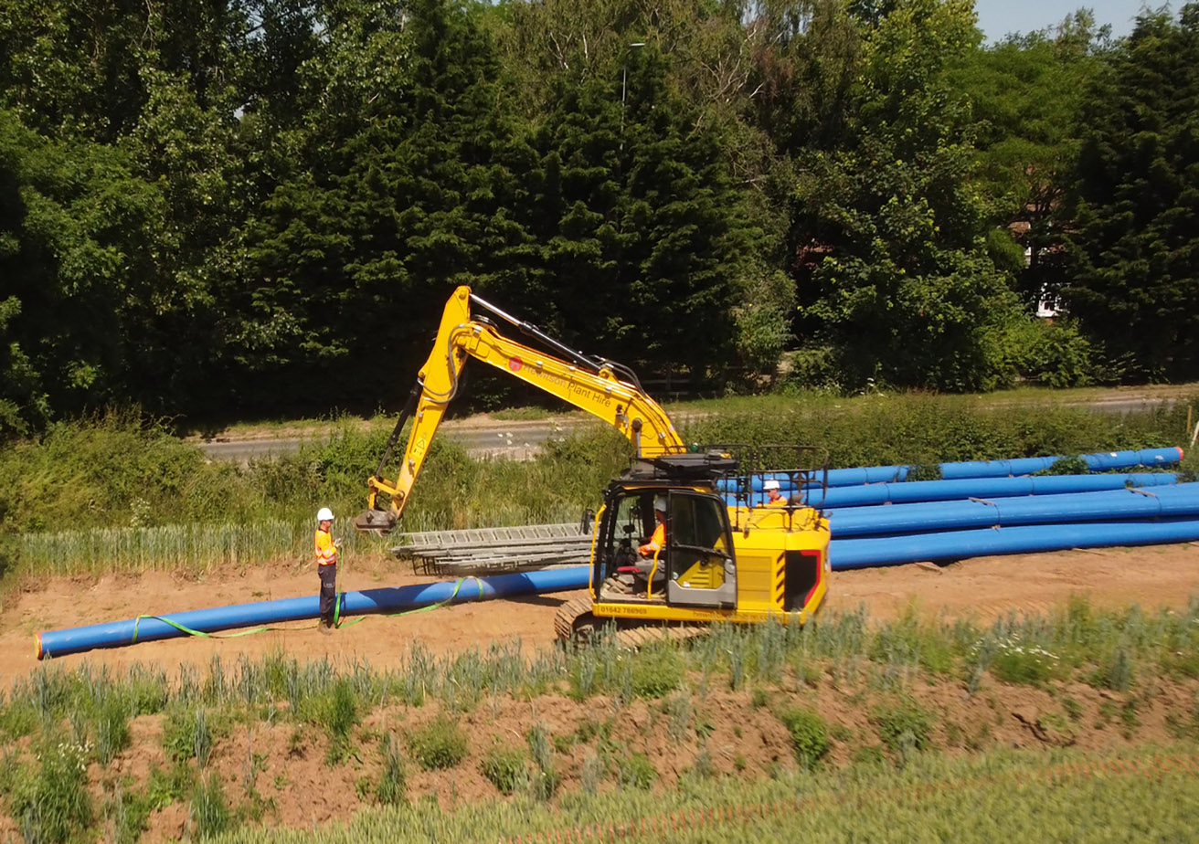 digger with on site worker