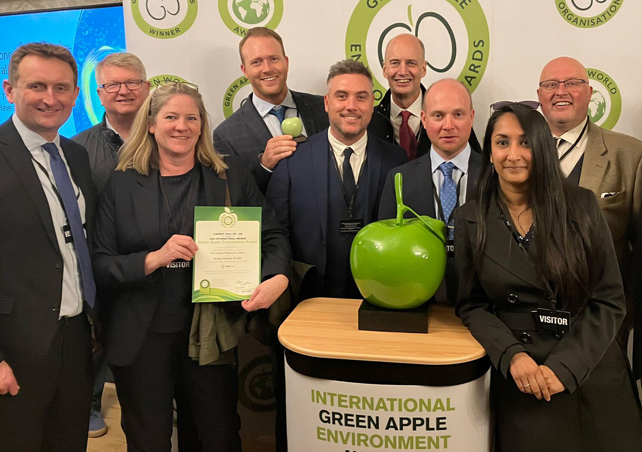 group of people celebrating win at the green apple environment awards